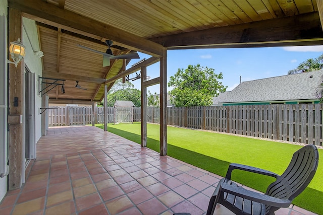6093 Lucerne St, Jupiter, FL 33458 - fenced backyard featuring a ceiling fan and a patio