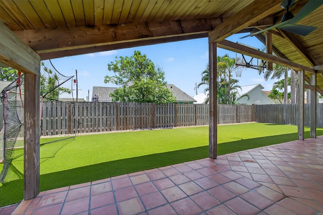 6093 Lucerne St, Jupiter, FL 33458 - fenced backyard with a patio and a putting green