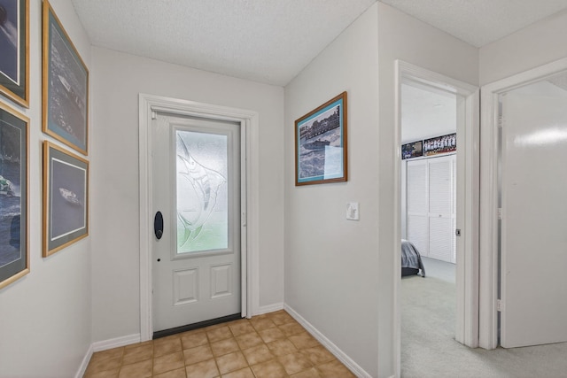6093 Lucerne St, Jupiter, FL 33458 - entrance foyer with healthy amount of natural light and a textured ceiling