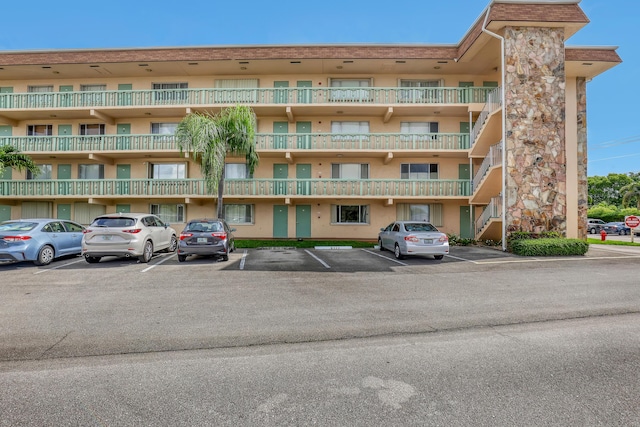 300 Village Green Cir S Unit 120, Palm Springs, FL 33461 - view of apartment building / complex with uncovered parking