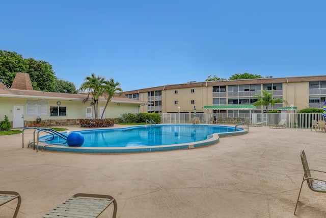 300 Village Green Cir S Unit 120, Palm Springs, FL 33461 - community pool with a patio area