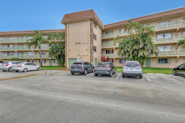 300 Village Green Cir S Unit 120, Palm Springs, FL 33461 - view of apartment building / complex with uncovered parking