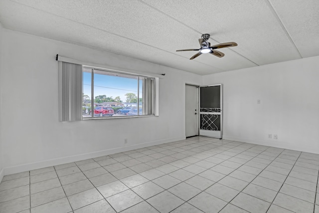 300 Village Green Cir S Unit 120, Palm Springs, FL 33461 - unfurnished room featuring a ceiling fan and a textured ceiling