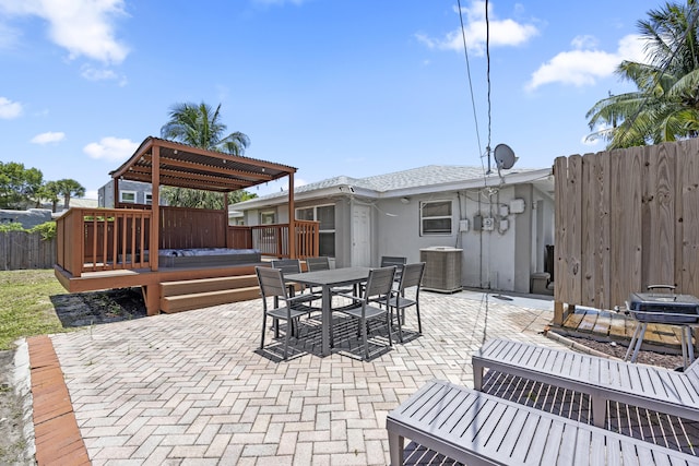 301 Southridge Rd, Delray Beach, FL 33444 - view of patio with a wooden deck, outdoor dining space, and a jacuzzi