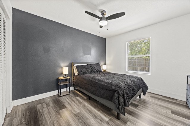 126 NW 6th Ave, Delray Beach, FL 33444 - bedroom with wood finished floors, a ceiling fan, and a textured wall