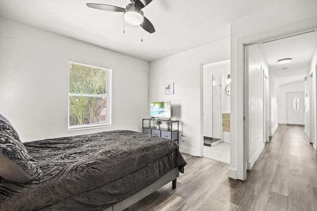 126 NW 6th Ave, Delray Beach, FL 33444 - bedroom featuring wood finished floors, ensuite bath, and a ceiling fan