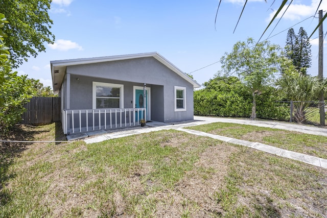 126 NW 6th Ave, Delray Beach, FL 33444 - view of front of house featuring a porch and stucco siding