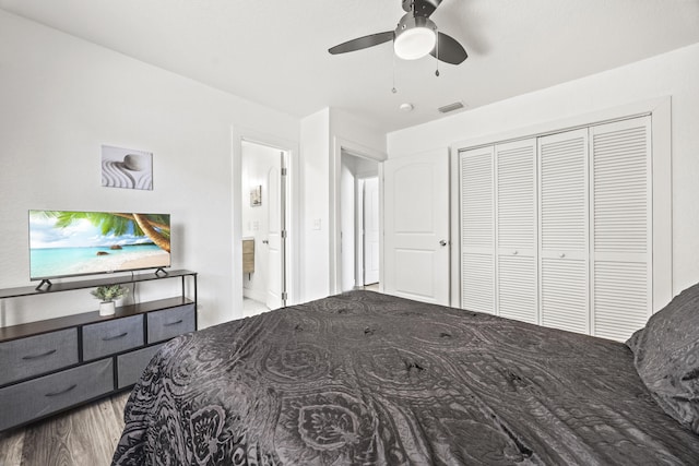 126 NW 6th Ave, Delray Beach, FL 33444 - bedroom featuring wood finished floors, ensuite bathroom, a ceiling fan, and a closet