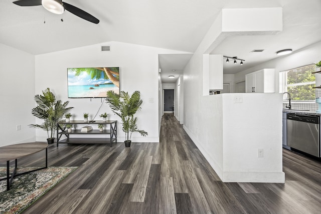 126 NW 6th Ave, Delray Beach, FL 33444 - hall with dark wood-style flooring, vaulted ceiling, and rail lighting