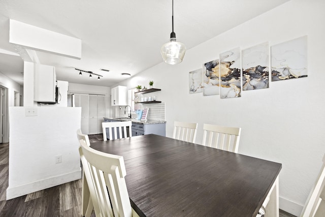 126 NW 6th Ave, Delray Beach, FL 33444 - dining room featuring dark wood-style flooring and track lighting