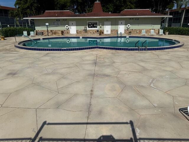 3000 Springdale Blvd Unit V204, Palm Springs, FL 33461 - community pool featuring a patio