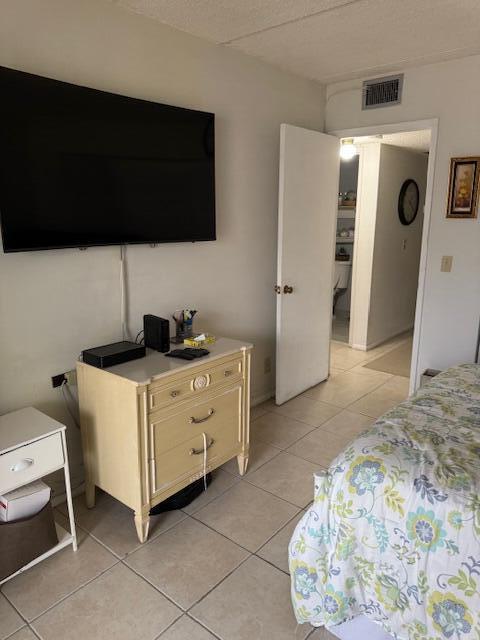3000 Springdale Blvd Unit V204, Palm Springs, FL 33461 - bedroom with light tile patterned floors