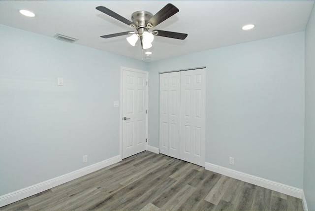 3580 Dunes Rd, Palm Beach Gardens, FL 33410 - unfurnished bedroom featuring wood finished floors, a closet, recessed lighting, and ceiling fan