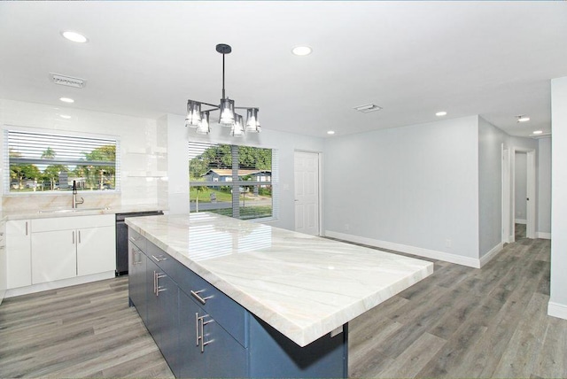 3580 Dunes Rd, Palm Beach Gardens, FL 33410 - kitchen featuring dishwasher, recessed lighting, white cabinets, a center island, and a chandelier
