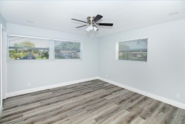 3580 Dunes Rd, Palm Beach Gardens, FL 33410 - spare room featuring plenty of natural light, wood finished floors, and ceiling fan