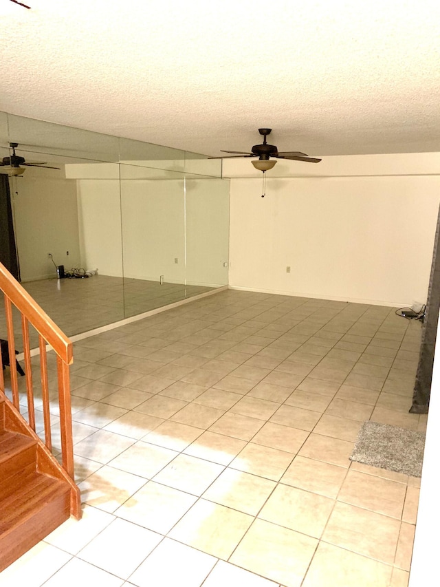 190 Charter Way, West Palm Beach, FL 33407 - unfurnished room featuring ceiling fan, a textured ceiling, light tile patterned floors, and stairway