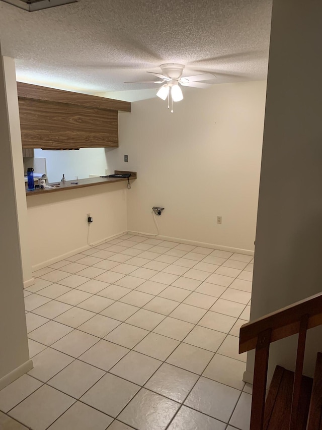 190 Charter Way, West Palm Beach, FL 33407 - empty room featuring ceiling fan, a textured ceiling, and light tile patterned flooring