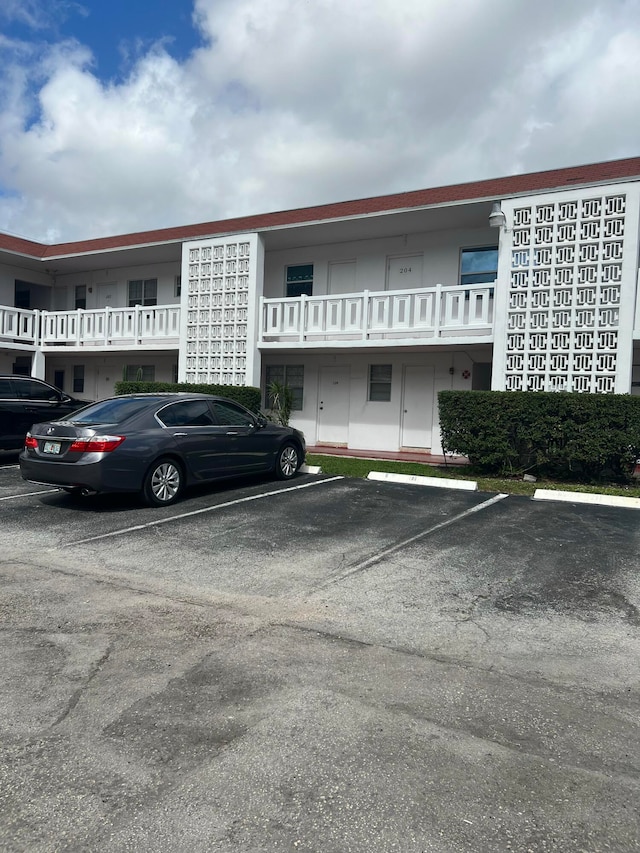 1280 NW 43rd Ter Unit 109, Lauderhill, FL 33313 - view of building exterior with uncovered parking