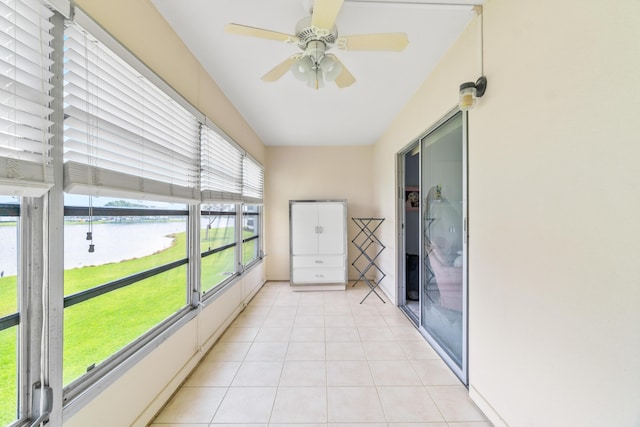 2054 Cornwall C, Boca Raton, FL 33434 - unfurnished sunroom featuring a water view, ceiling fan, and tile patterned floors