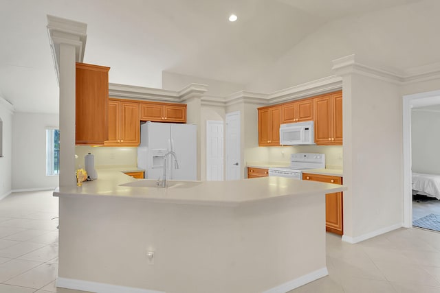 3601 SW Europe St, Port Saint Lucie, FL 34953 - kitchen featuring white appliances, light countertops, a peninsula, light tile patterned flooring, and lofted ceiling
