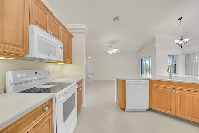 3601 SW Europe St, Port Saint Lucie, FL 34953 - kitchen featuring white appliances, a chandelier, lofted ceiling, light countertops, and pendant lighting