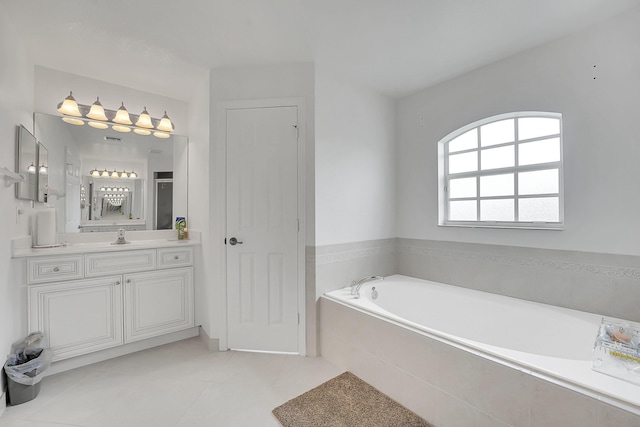 3601 SW Europe St, Port Saint Lucie, FL 34953 - full bath featuring vanity, a bath, and tile patterned flooring