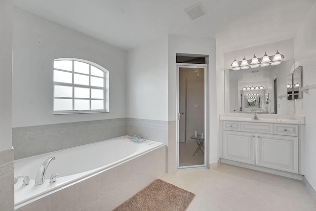 3601 SW Europe St, Port Saint Lucie, FL 34953 - full bath featuring a bath, vanity, a stall shower, and tile patterned floors