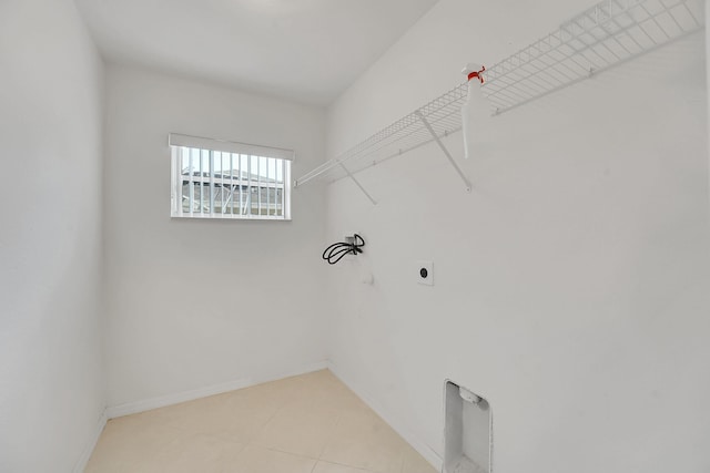 3601 SW Europe St, Port Saint Lucie, FL 34953 - laundry room featuring electric dryer hookup and light tile patterned flooring