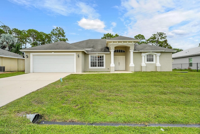 3601 SW Europe St, Port Saint Lucie, FL 34953 - view of front of home with stucco siding, a garage, and driveway
