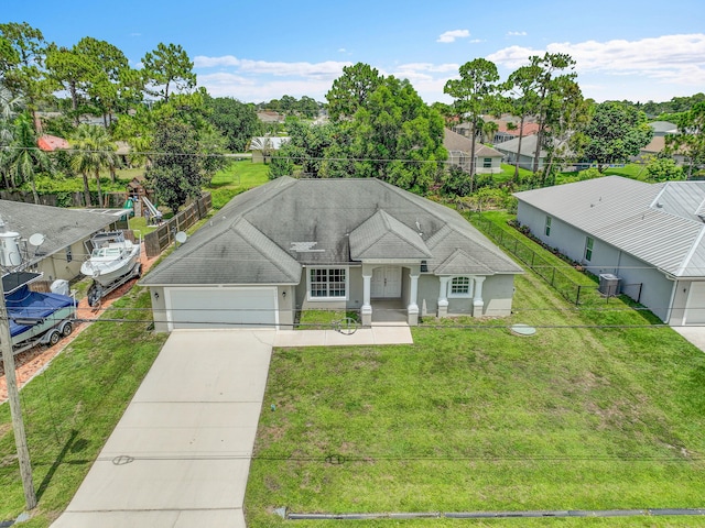 3601 SW Europe St, Port Saint Lucie, FL 34953 - ranch-style home featuring an attached garage, driveway, and stucco siding