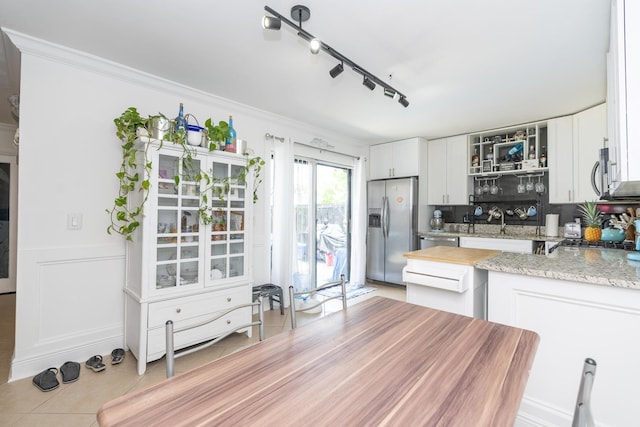 2140 White Pine Cir Unit A, Greenacres, FL 33415 - kitchen featuring stainless steel appliances, glass insert cabinets, crown molding, white cabinets, and light stone countertops
