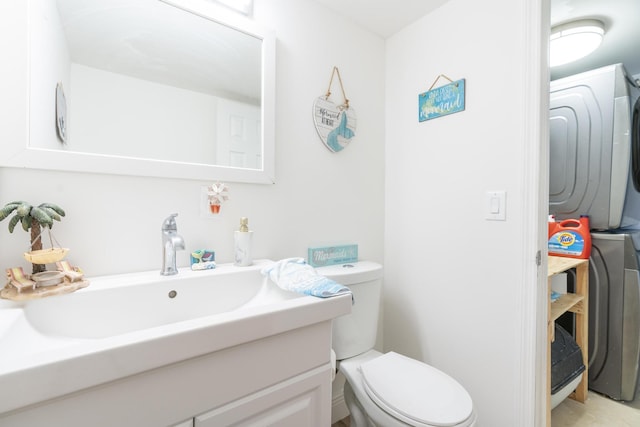 2140 White Pine Cir Unit A, Greenacres, FL 33415 - bathroom featuring stacked washer / dryer and vanity