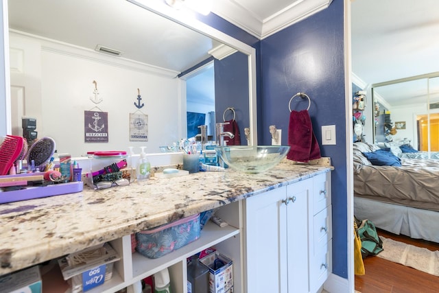 2140 White Pine Cir Unit A, Greenacres, FL 33415 - ensuite bathroom featuring ornamental molding, vanity, and wood finished floors