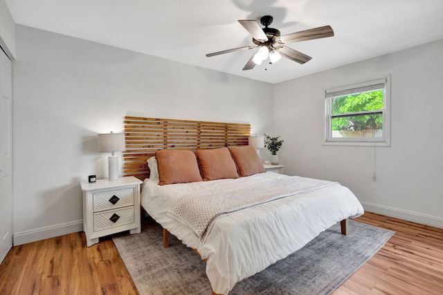 5914 SE Mitzi Ln, Stuart, FL 34997 - bedroom with light wood-type flooring and ceiling fan