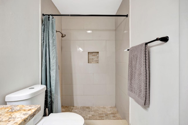 5914 SE Mitzi Ln, Stuart, FL 34997 - bathroom with toilet and tiled shower