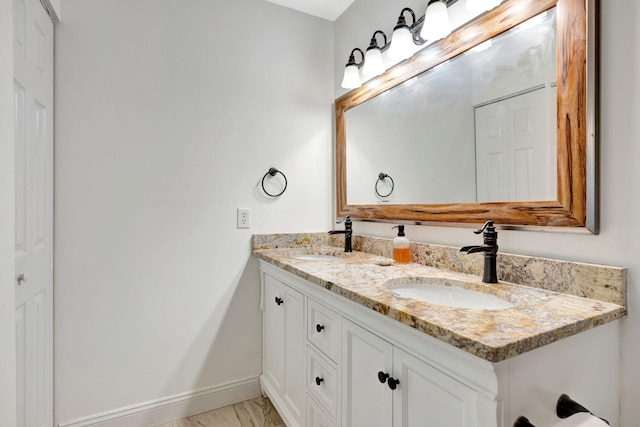 5914 SE Mitzi Ln, Stuart, FL 34997 - bathroom featuring double vanity and marble finish floors