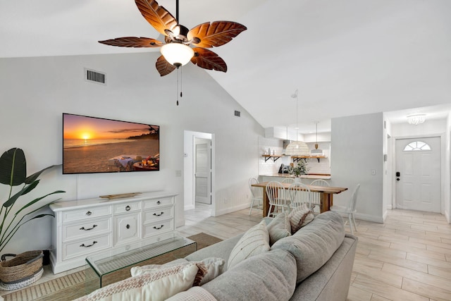 5914 SE Mitzi Ln, Stuart, FL 34997 - living room featuring a ceiling fan and high vaulted ceiling