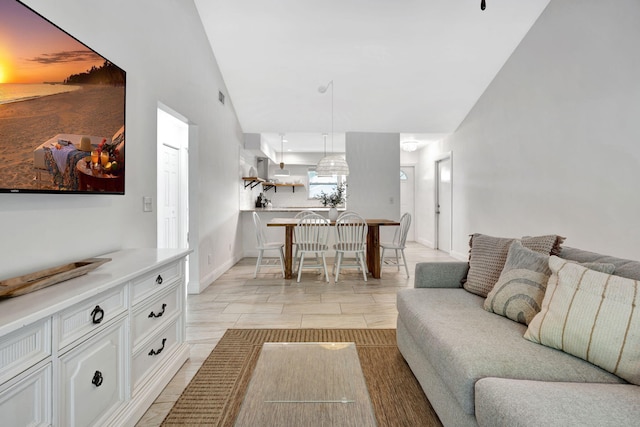 5914 SE Mitzi Ln, Stuart, FL 34997 - living room featuring vaulted ceiling