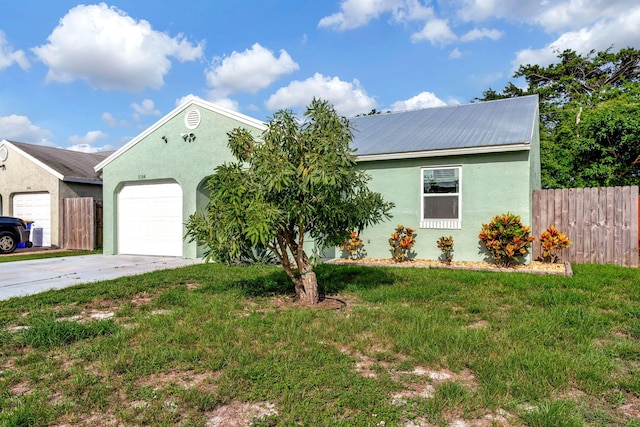 5914 SE Mitzi Ln, Stuart, FL 34997 - ranch-style house featuring a garage, stucco siding, driveway, and a metal roof