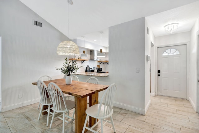 5914 SE Mitzi Ln, Stuart, FL 34997 - dining room featuring baseboards and a chandelier