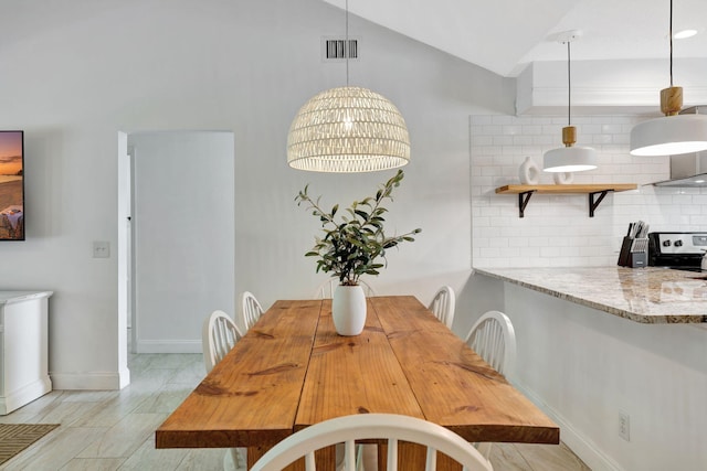 5914 SE Mitzi Ln, Stuart, FL 34997 - dining space with lofted ceiling and baseboards