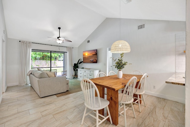 5914 SE Mitzi Ln, Stuart, FL 34997 - dining area with a ceiling fan and high vaulted ceiling