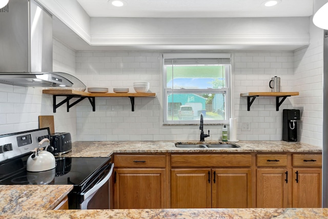 5914 SE Mitzi Ln, Stuart, FL 34997 - kitchen with stainless steel range with electric stovetop, open shelves, extractor fan, decorative backsplash, and light stone countertops