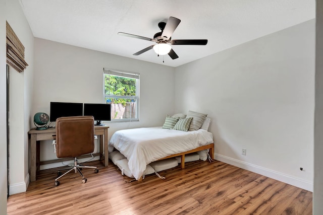5914 SE Mitzi Ln, Stuart, FL 34997 - bedroom featuring light wood-style flooring and ceiling fan