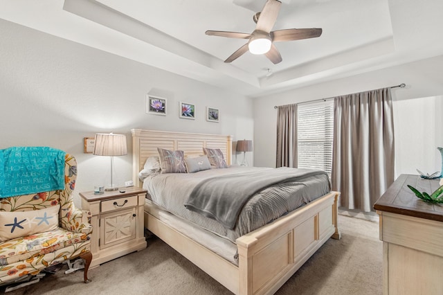 2418 Post St, Palm Springs, FL 33406 - bedroom with light colored carpet, a raised ceiling, and ceiling fan