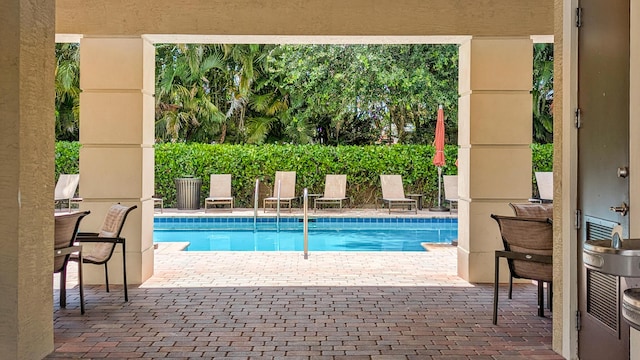 2418 Post St, Palm Springs, FL 33406 - community pool with a patio area