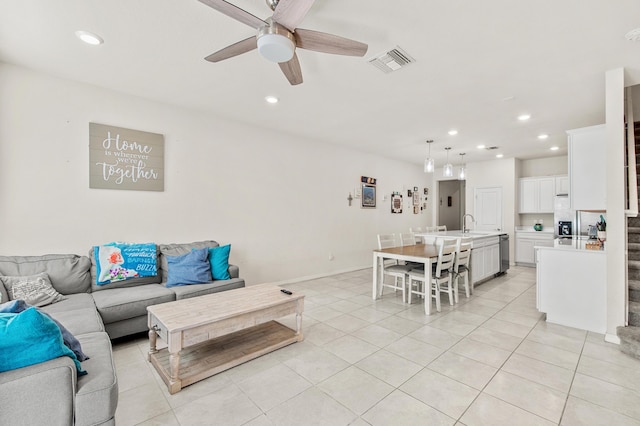 2418 Post St, Palm Springs, FL 33406 - living area featuring a ceiling fan, recessed lighting, light tile patterned floors, and stairs
