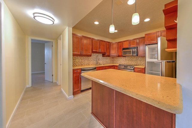 2050 Oleander Blvd Unit 5301, Fort Pierce, FL 34950 - kitchen featuring stainless steel appliances, decorative backsplash, pendant lighting, light tile patterned flooring, and recessed lighting