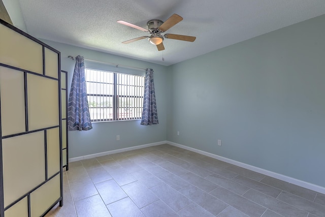 2050 Oleander Blvd Unit 5301, Fort Pierce, FL 34950 - unfurnished room featuring a ceiling fan, light tile patterned floors, and a textured ceiling