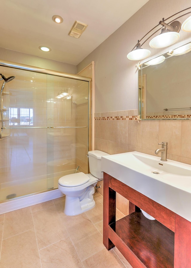 2050 Oleander Blvd Unit 5301, Fort Pierce, FL 34950 - bathroom with a stall shower, tile walls, vanity, tile patterned flooring, and recessed lighting